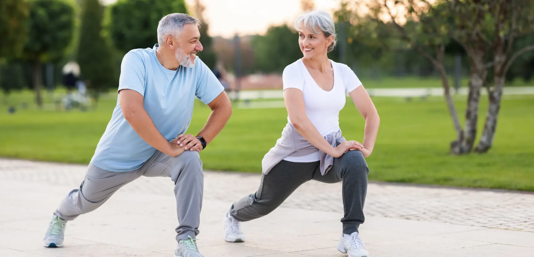 Middle aged couple doing exercise
